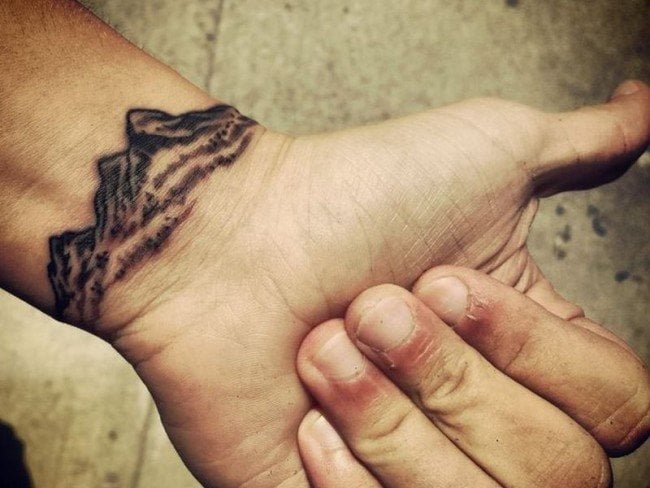 3. Meaningful Wrist Tattoos for Men - wide 4