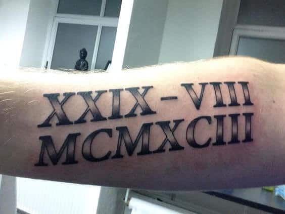 3. Small Roman Numeral Bicep Tattoos - wide 7